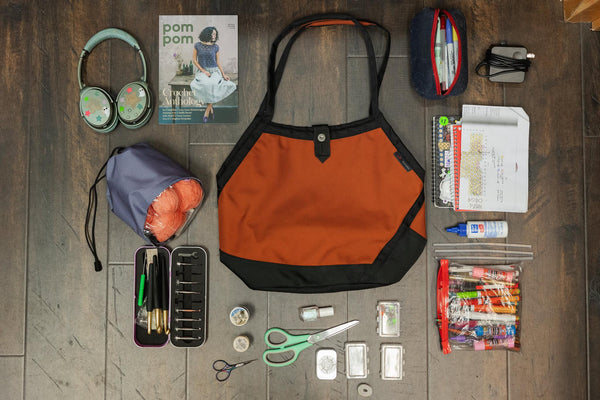 A Swift with crafting items laid out around it.